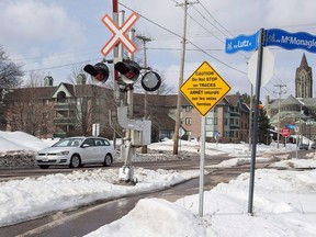 A railway crossing is seen in Moncton, N.B. on Wednesday, Feb. 14, 2018. Three years after a Moncton man in an electric wheelchair was killed by a CN train at a level crossing in the city, a lawsuit in his death has been resolved.