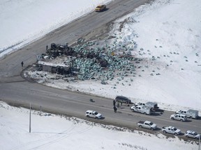 The wreckage of the Humboldt Broncos hockey bus crash is shown outside of Tisdale, Sask., on Saturday, April, 7, 2018. Several families affected by the deadly Humboldt Broncos hockey bus crash say they are upset by an Alberta review into its trucking regulations.