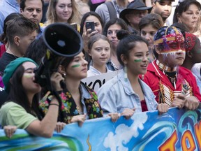 Swedish activist and student Greta Thunberg, centre, takes part in the Climate Strike, in Montreal on Friday, Sept. 27, 2019. Swedish activist Greta Thunberg is planning to be at the Alberta legislature on Friday for a climate strike.