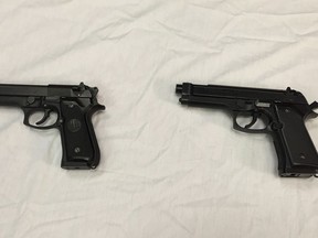 FILE - This April 28, 2016, file photo shows a semi-automatic handgun, left, next to a Powerline 340 BB gun, right, displayed during a news conference in Baltimore. A Manitoba judge is calling for new rules governing imitation firearms, in order to reduce the risk of fatal shootings involving police and so-called suicides-by-cop.