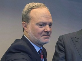 Andre Pratte attends the launch of the book "Legacy," Monday, November 14, 2016 in Montreal. Andre Pratte is announcing his resignation from the Senate as the federal election results are rolling in.