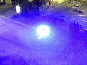A blue laser beam is seen from an Edmonton Police helicopter in this recent handout photo. Charges have been laid against a man who allegedly pointed a laser beam at the Edmonton police helicopter. Police say the aircraft -- known as Air 1 -- had two crewmembers aboard and was flying over the city's north end early Saturday morning when it was struck several times by a blue light.
