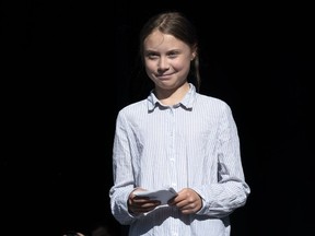 Swedish activist and student Greta Thunberg walks off the stage after addressing the Climate Strike in Montreal on Friday, Sept. 27, 2019. The Alberta government won't seek out a meeting with teen Swedish climate activist Greta Thunberg, but Environment Minister Jason Nixon says he hopes she takes the time to learn about the province's oil and gas industry.