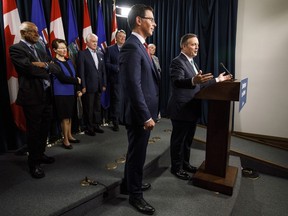 Alberta Premier Jason Kenney, right and Doug Schweitzer, Minister of Justice and Solicitor General, provide details about Bill 13, the Alberta Senate Election Act., in Edmonton on Wednesday June 26, 2019.