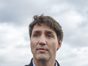 Liberal Leader Justin Trudeau speaks to the media while campaigning in Saint-Anaclet, Que., on Friday, October 4, 2019. Trudeau's combative attitude to some provincial premiers may not be just campaign rhetoric - his platform is promising to turn it into government policy if the Liberals are re-elected.