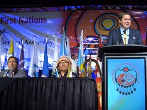 Conservative Party leader Andrew Scheer, right, speaks during the opening of the Assembly of First Nations annual general meeting in Regina, Sask., Tuesday July 25, 2017. First Nations chiefs in Andrew Scheer's home riding say they haven't seen much of him in advance of Monday's federal vote, and feel like they're not a priority for the Conservative leader.