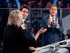 Liberal Leader Justin Trudeau looks on as Conservative Leader Andrew Scheer and Green Party leader Elizabeth May discuss a point during the Federal leaders debate in Gatineau, Quebec, Oct. 7, 2019.