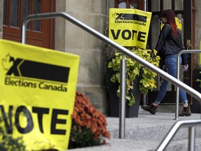 A resident walks into a polling station in Toronto during the Oct. 21, 2019, federal election.