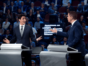 Liberal Leader Justin Trudeau, left, and Conservative Leader Andrew Scheer take part in a French-language leaders debate in Gatineau, Que. on Oct. 10, 2019.
