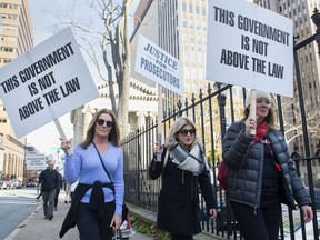 Crown attorneys continue their protest outside the legislature in Halifax on Friday, Oct. 25, 2019. Most of the province's Crown attorneys walked off the job on Wednesday in response to the province introducing legislation that would take away their right to arbitration. The provincial government is seeking an injunction in Nova Scotia Supreme Court that would force the Crowns back to the courtroom.