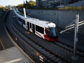 An LRT train on OC Transpo's new O-Train Confederation Line departs Lees Station in Ottawa, on Friday, Oct. 11, 2019.