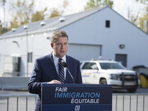 Conservative leader Andrew Scheer makes a morning announcement at the Canada/USA boarder on Roxham road during a campaign stop in Lacolle, Que. Wednesday, October 9, 2019.