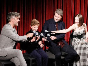 Writer, director, producer Taika Waititi, actor Roman Griffin Davis and producer Carthew Neal on stage during The Academy of Motion Pictures Arts and Sciences official Academy screening of JoJo Rabbit at the MoMA Celeste Bartos Theater on October 17, 2019 in New York City.