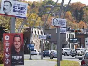 Electoral signs of candidates are seen in Saint-Georges, Que., Friday, Oct. 11, 2019.