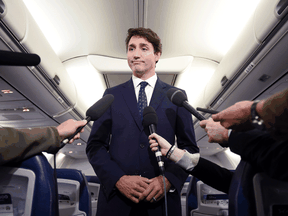 Liberal Leader Justin Trudeau speaks to reporters on his main campaign plane, a Boeing 737-800.