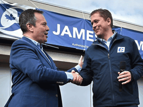Alberta Premier Jason Kenney with Conservative Leader Andrew Scheer while campaigning for candidate James Cumming in Edmonton, Sept. 28, 2019.