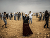 Kurdish civilians watching clashes between ISIL jihadists and Kurdish fighters in Sanliurfa province, September 2014.