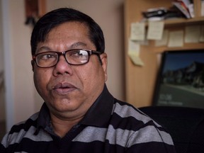 Nalliah Balachandran struggles to control his emotions as he contemplates his legal troubles at his home in Calgary, Alta., Tuesday, Dec. 4, 2018. A man who lost hundreds of thousands of dollars because of a negligent lawyer has finally received partial compensation years after winning a court judgment that has proven unenforceable.