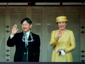 In this file photo taken on May 4, 2019, Japan's Emperor Naruhito (L) and Empress Masako (R) make their first public appearance after ascending to the throne at the Imperial Palace in Tokyo.