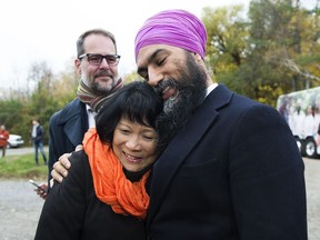 NDP leader Jagmeet Singh, hugs Olivia Chow, widow of former NDP leader Jack Layton as they make an announcement at Jack Layton Park during a campaign stop in Hudson, Que., on Wednesday, October 16, 2019.