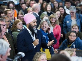 NDP leader Jagmeet Singh, left, and provincial NDP leader Andrea Horwath, right, speak to supporters at the Blue Star diner during a campaign stop in Welland Ont., on Thursday, October 17, 2019.