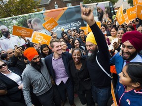 NDP leader Jagmeet Singh, second right, dances with supporters and candidates during a campaign stop in Brampton, Ont., on Saturday, October 12, 2019.