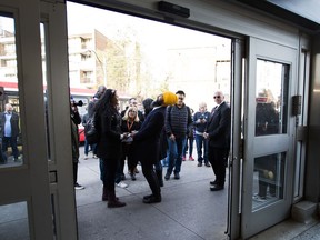 NDP leader Jagmeet Singh greets transit commuters during a campaign stop in Toronto on Tuesday, October 15, 2019.