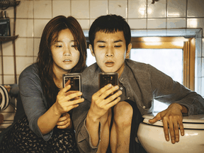 Woo-sik Choi and So-dam Park in a scene from Parasite.