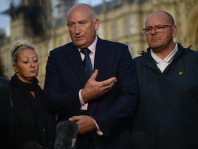 Family spokesman Radd Seiger speaks on behalf of father of Harry Dunn, Tim Dunn (R) and mother Charlotte Charles (L) after meeting with Foreign Secretary Dominic Raab on October 9, 2019 in London, England. Motorcyclist Harry Dunn, 19, died in a collision with a car in Northamptonshire on August 27th.