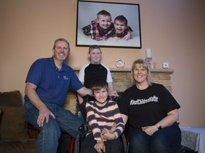 Kimberly and Todd Churchill, with sons Carter, front, and Hunter, pose for a photo at their home in Portugal Cove-St. Philip's Newfoundland on Monday, October 28, 2019.