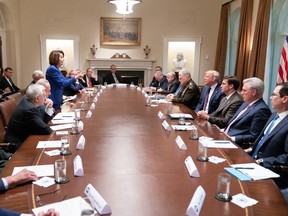 House Speaker Nancy Pelosi is pictured standing during a White House meeting and pointing her finger at a seated President Donald Trump. Pelosi made this photo her Twitter cover picture after Trump attempted to mock her with it.
