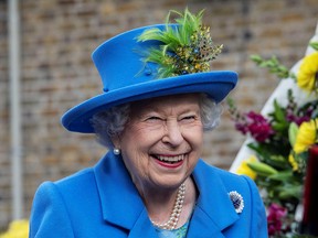 Queen Elizabeth opens a new housing development for armed forces veterans in London, England, on Oct. 11, 2019. Two professors of constitutional law argued unsuccessfully that Canada's constitution required amendment as a result of Britain changing its rules regarding accession to the throne.