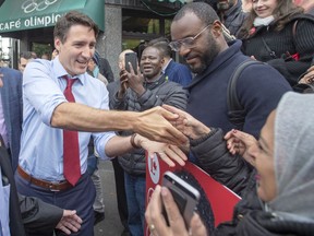 Liberal leader Justin Trudeau greets supporters while campaigning Thursday, October 3, 2019 in Montreal, Quebec.