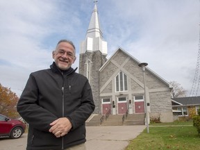 Rene Beaudoin, a parishioner and responsible for the areas churches, stands in front of Saint-Jean-de-Brebeuf Church on Wednesday, October 30, 2019 in Trois-Rivieres, Que. The Roman Catholic bishop of Trois-Rivieres has announced that his diocese will postpone selling the church to its neighbour, the Islamic Cultural Centre of the Mauricie, after an outcry from some parishioners over the pending sale to the Muslim community.