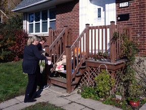 Neighbours leave stuffed animals and toys at the doorstep of a home in Montreal on Wednesday, Oct. 23, 2019. Montreal police are investigating the discovery of the bodies of two children and their father as an apparent double murder followed by a suicide. Police say a woman phoned 911 just after 9 p.m. Tuesday to report that three people were possibly dead inside an east-end home -- a 40 year-old man, a seven-year-old boy and a five-year-old girl.