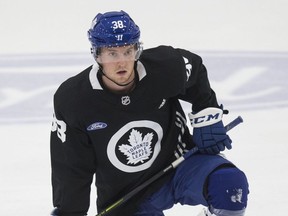 Maple Leafs defenceman Rasmus Sandin takes a knee during practice at the Ford Performance Centre on Monday. Sandin has made Toronto's opening-night roster. (Craig Robertson/Toronto Sun)