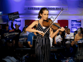 A fiddler performs at Conservative Leader Andrew Scheer's campaign stop in Little Harbour, Nova Scotia, Oct. 17, 2019.