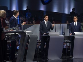 Federal party leaders, left to right, NDP leader Jagmeet Singh, Green Party leader Elizabeth May, People's Party of Canada leader Maxime Bernier, Liberal leader Justin Trudeau, Conservative leader Andrew Scheer, take part in the Federal leaders French language debate in Gatineau, Que. on Thursday, October 10, 2019.