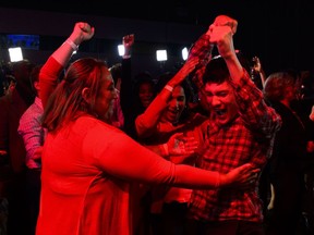 Liberal supporters react as poll numbers come in at Liberal election headquarters in Montreal on Monday Oct. 21, 2019.