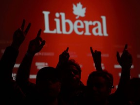 Liberal supporters react as poll numbers come in at Liberal election headquarters in Montreal on Monday Oct. 21, 2019.