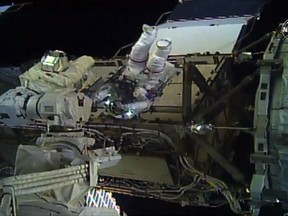 This image taken from NASA TV shows, astronaut Christina Koch during her spacewalk outside the International Space Station on October 18, 2019.