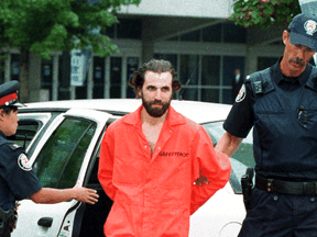 Steven Guilbeault is taken into custody by Toronto police after scaling the CN Tower in July 2001. "To me, civil disobedience was never a goal in and of itself. It was just a tool," Guilbeault now says.
