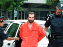 Steven Guilbeault is taken into custody by Toronto police after scaling the CN Tower in July 2001. 