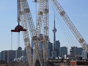 The downtown skyline and CN Tower are seen past cranes in the waterfront area envisioned by Alphabet Inc's Sidewalk Labs as a new technical hub in the Port Lands district of Toronto.