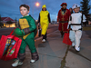 “Dress warm, wear rain gear, and go have fun.” Trick-or-treaters in Calgary.