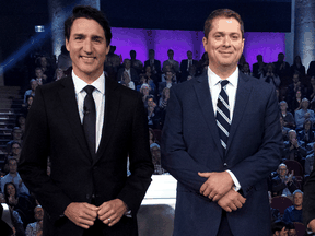 Liberal Leader Justin Trudeau stands next to Conservative Leader Andrew Scheer before the federal leaders debate in Gatineau, Quebec, Oct. 7, 2019.