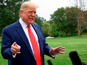 In this file photo taken on October 3, 2019 US President Donald Trump speaks to the press as he departs the White House in Washington, DC, for Florida.