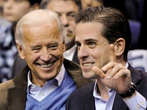 U.S. Vice President Joe Biden and his son Hunter Biden attend an NCAA basketball game between Georgetown University and Duke University in Washington, U.S., January 30, 2010.