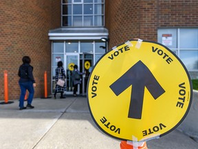 Calgarians enter South Gate Alliance Church to vote in the 2019 federal election on Oct. 21, 2019.