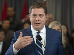 Conservative leader Andrew Scheer responds to questions from the media during a campaign stop in Toronto. Saturday, October 19, 2019.